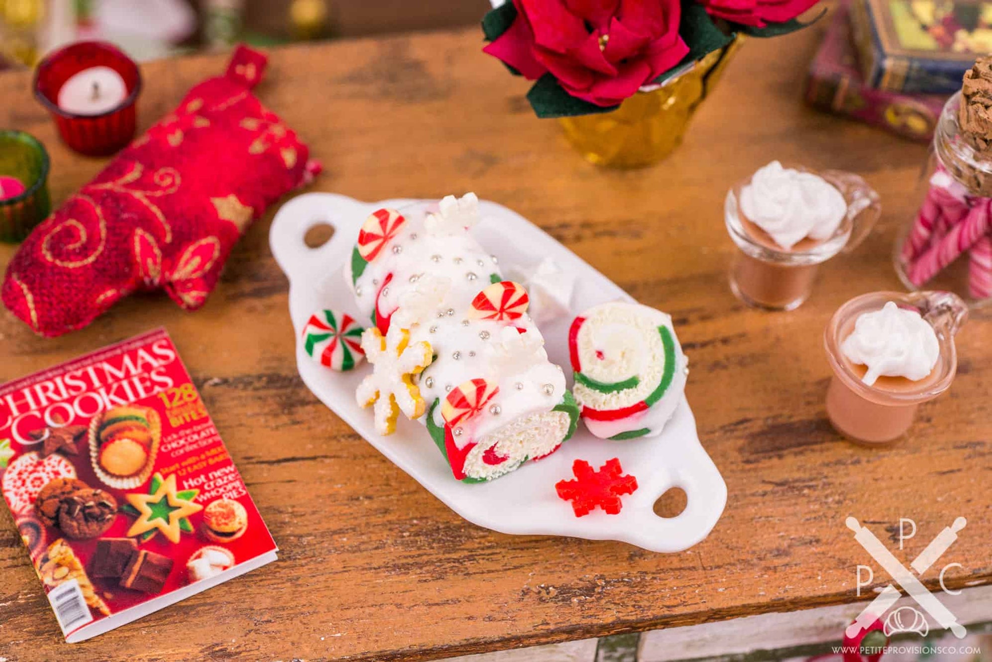 Miniature Christmas Swiss roll cake decorated for the holidays.