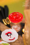 Close-up of a 1:12 scale Corazón de Sangre Margarita with a vivid red cocktail and sugar-coated rim, displayed beside a Día de los Muertos miniature plate featuring a painted skull.